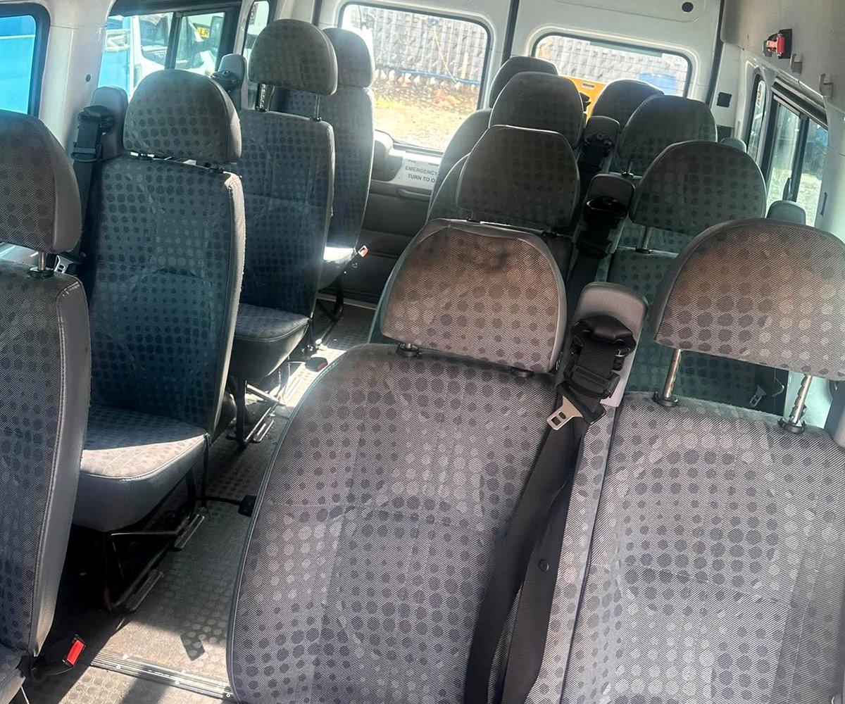 Grey cloth seating inside a 12 seat Compare Minibus Travel minibus