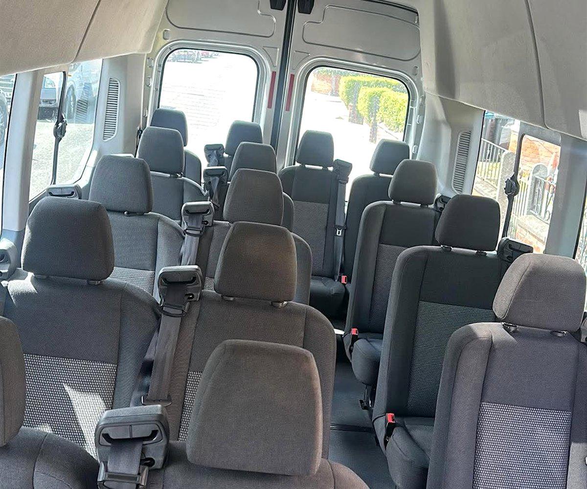 Grey cloth seating inside a Compare Minibus Travel minibus